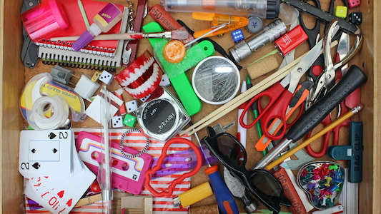 Colorful collection of random items in a drawer